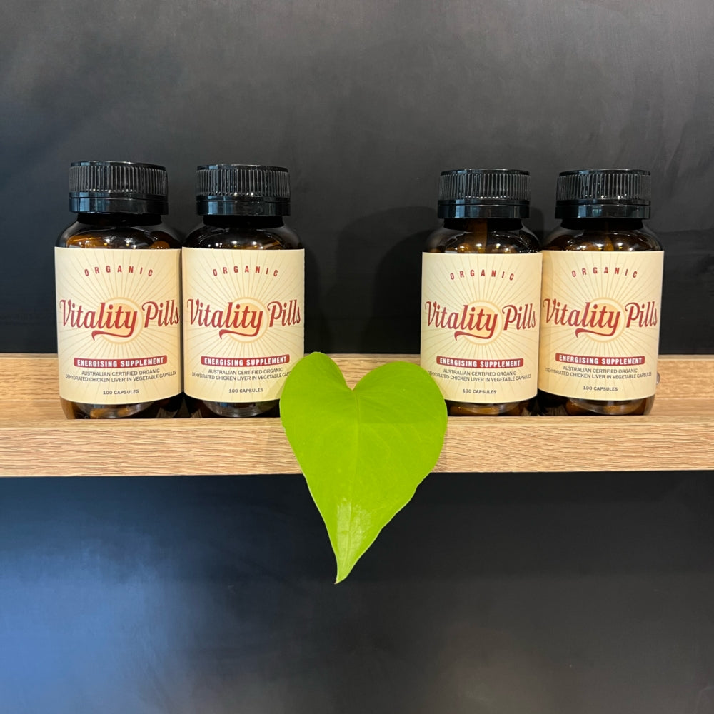 Organic Chicken Liver Capsules in Vitality Pills amber glass jars on a shelf.