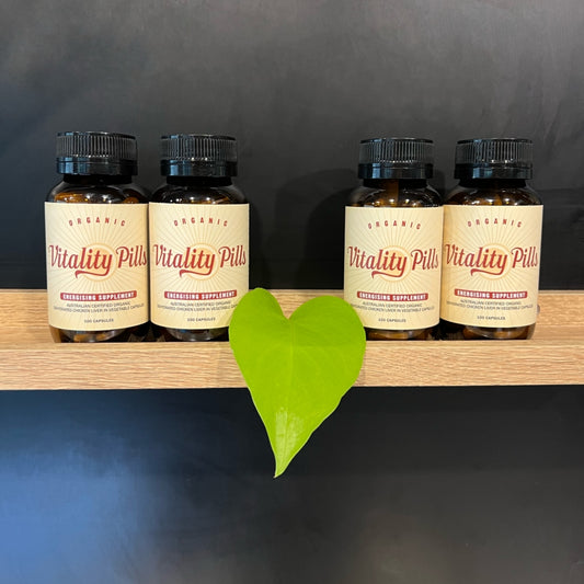 Organic Chicken Liver Capsules in Vitality Pills amber glass jars on a shelf.